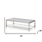 55" Clear And Silver Glass And Steel Coffee Table